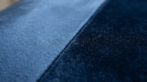Close up showing how velvet sofa pile direction changes the fabric’s colour and sheen.