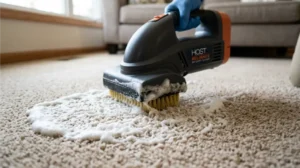 Dry foam being applied to carpet fibers during low moisture cleaning